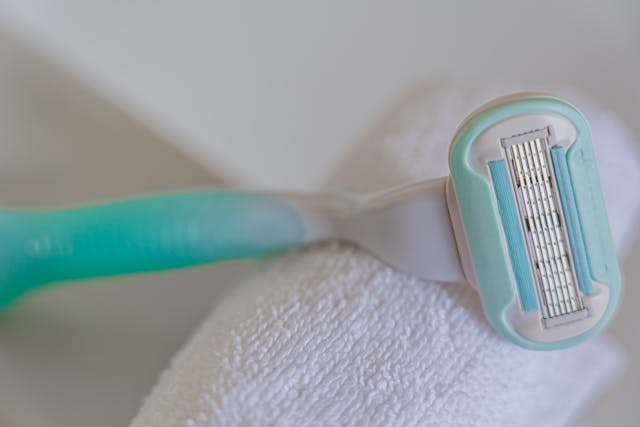 A Blue and White Shaving Razor in Macro Photography